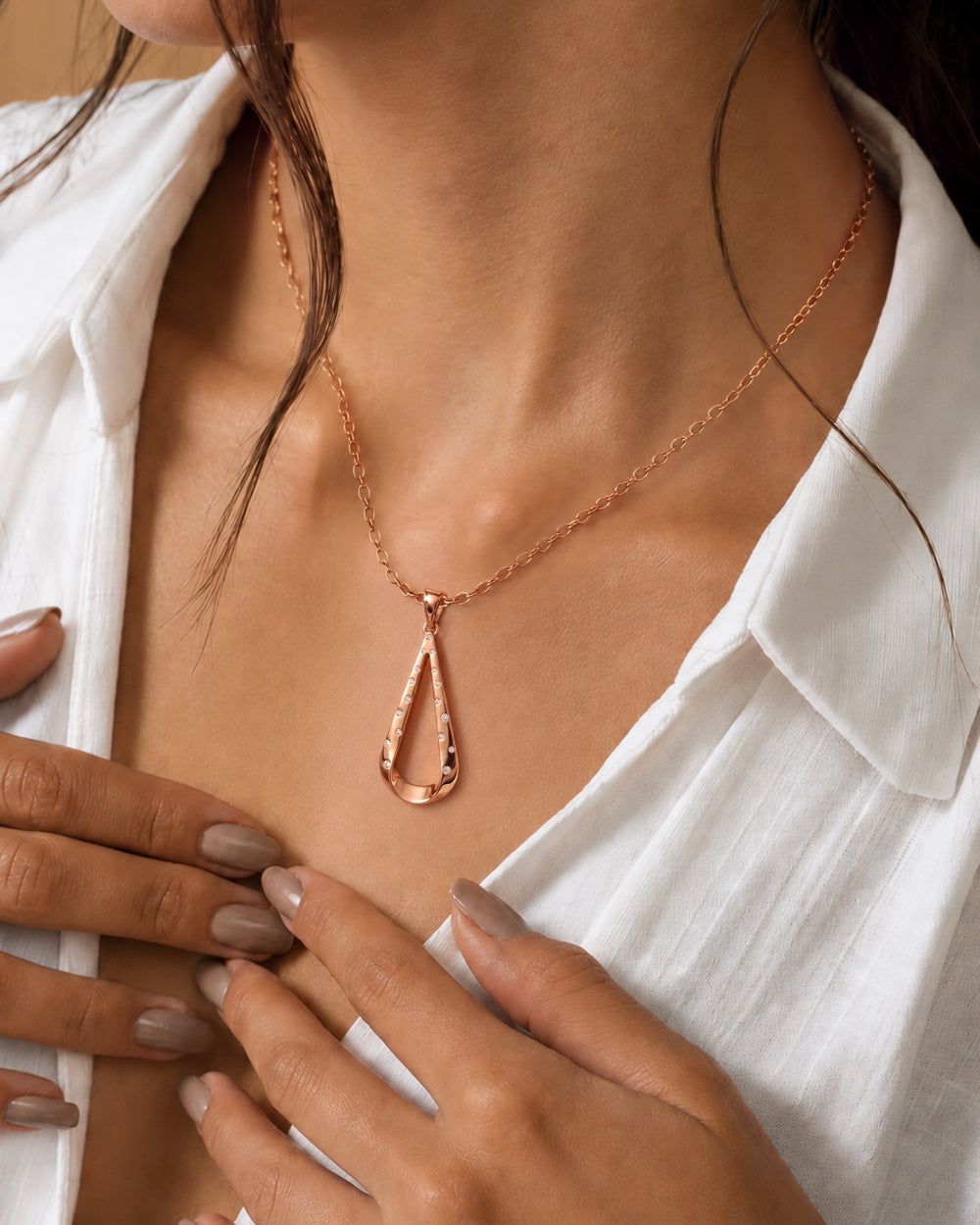 Helix Intreccio Pendant in 18kt rose gold vermeil over 925 sterling silver, shown worn