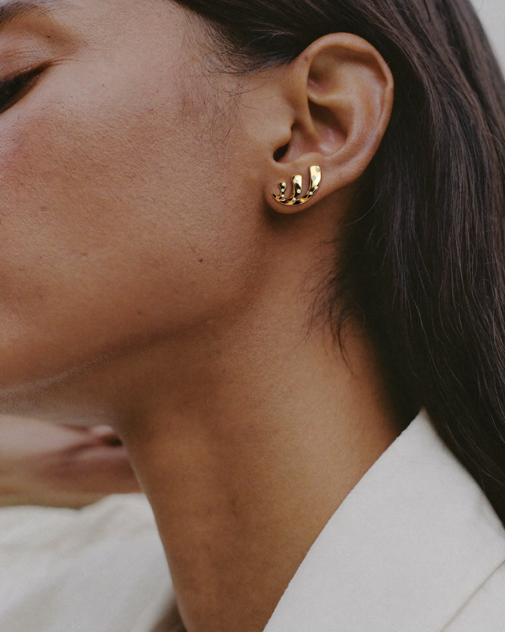 Helix Voluta Earrings in 18kt gold vermeil over 925 sterling silver, shown worn