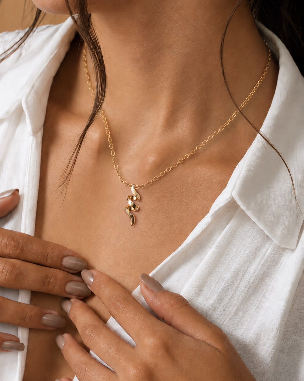 Helix Voluta Pendant in 18kt gold vermeil over 925 sterling silver, shown worn